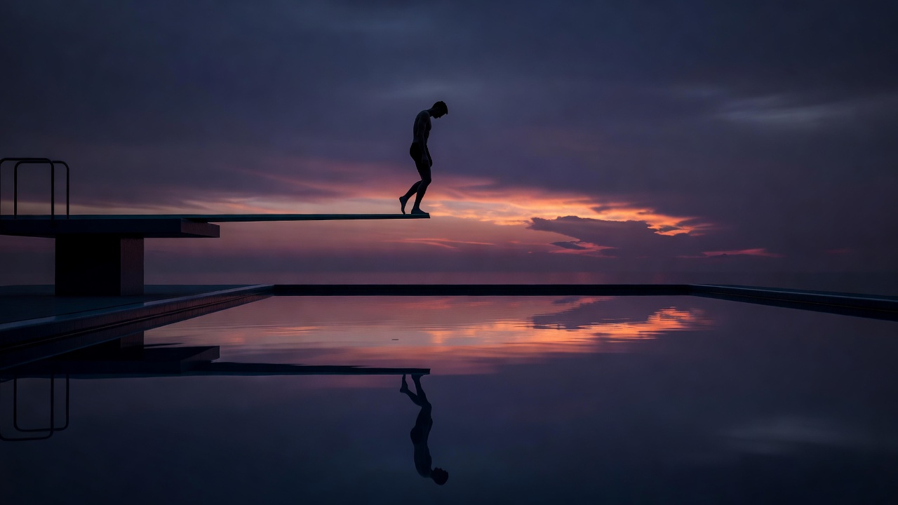 Una figura solitaria detenida al borde de un trampolín alto sobre una piscina en calma al atardecer